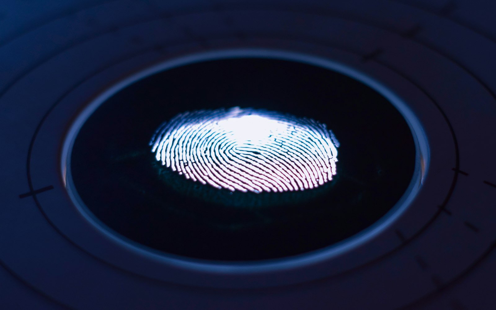 Fingerprint glowing on a scanner surface