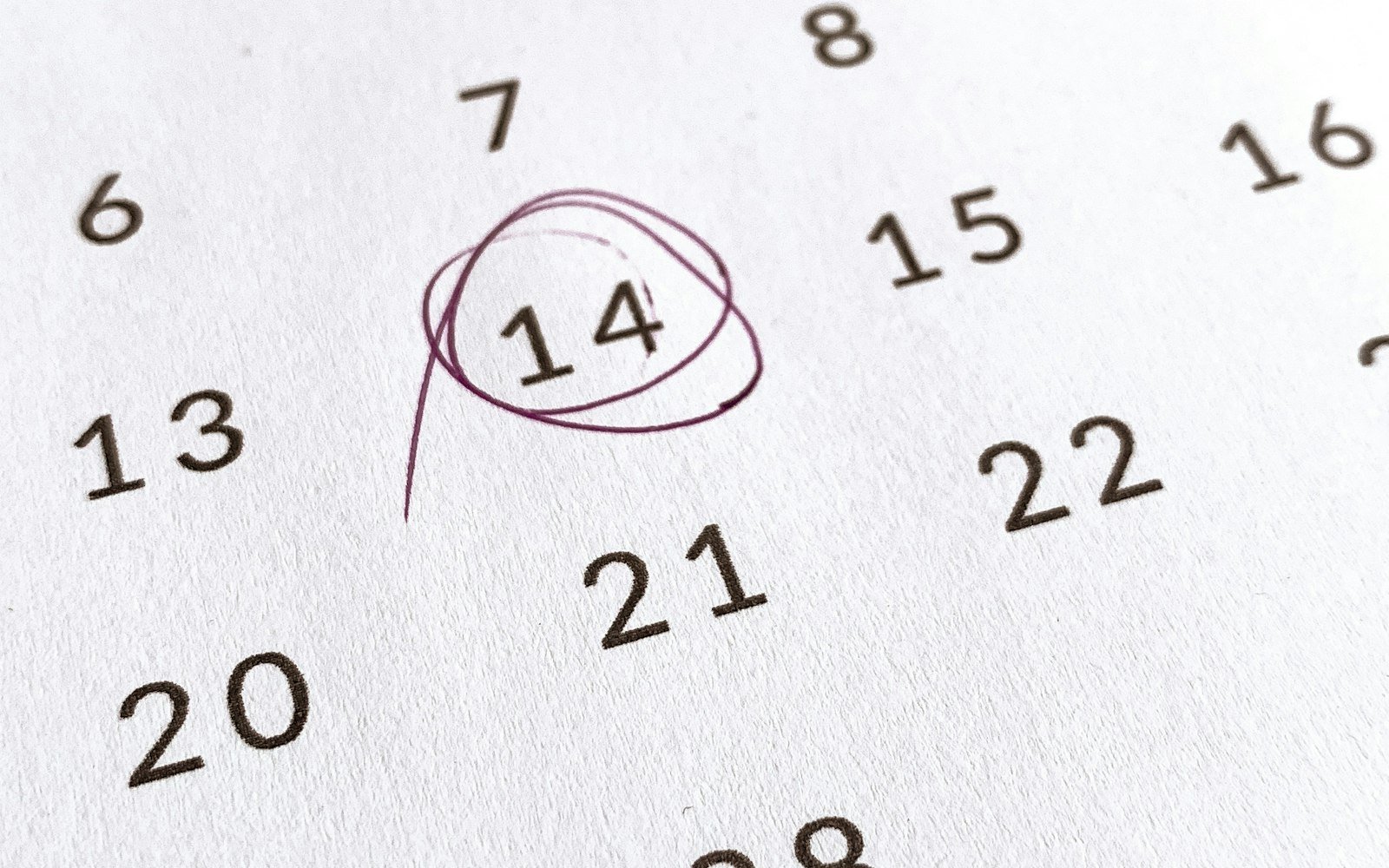 A calendar with one date circled in pen