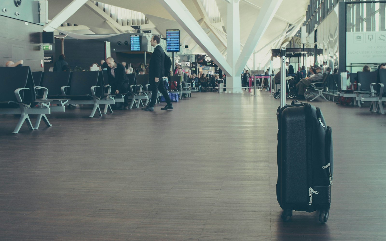A suitcase standing in an airport hall
