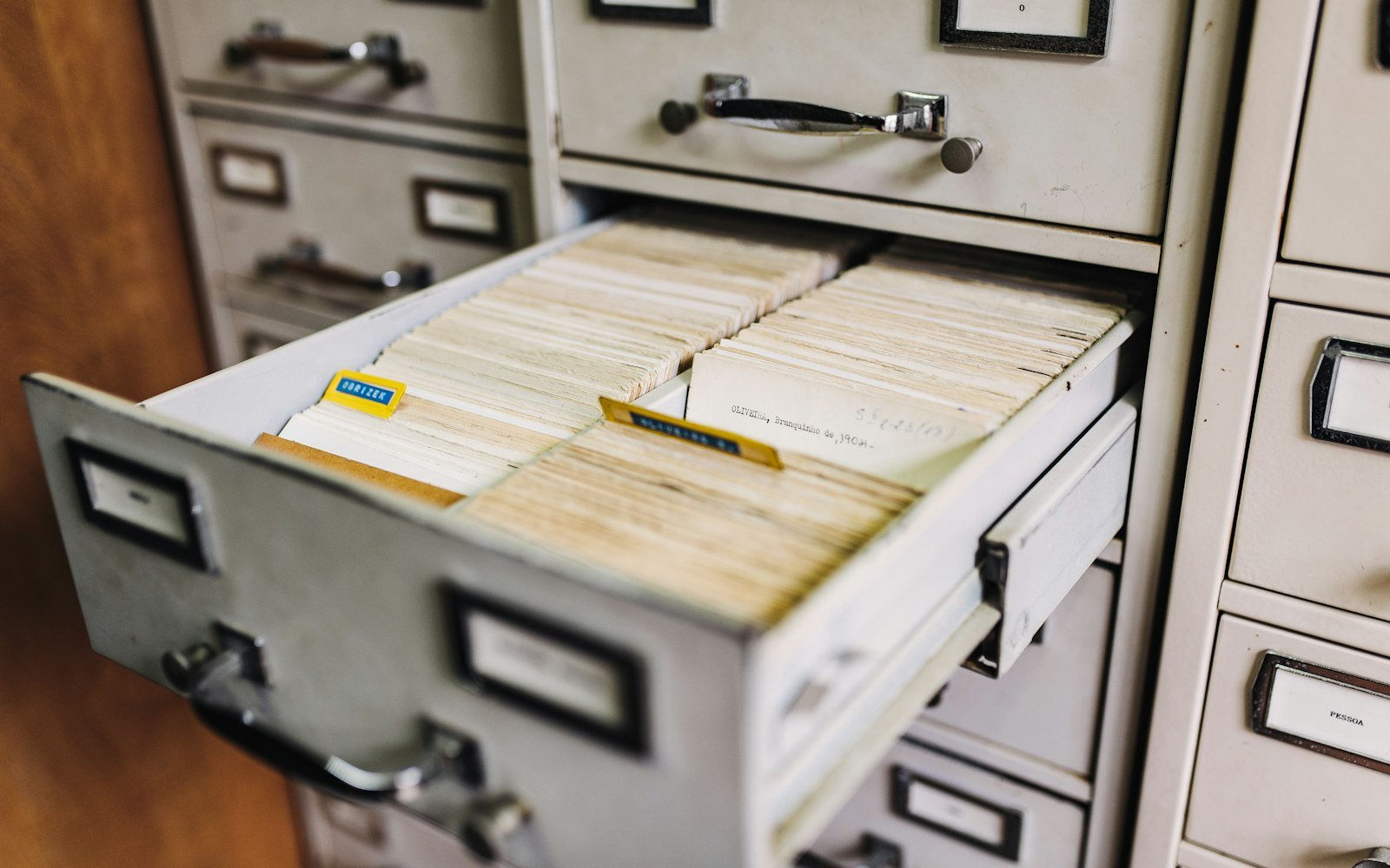 Open drawer of a filing cabinet with index cards