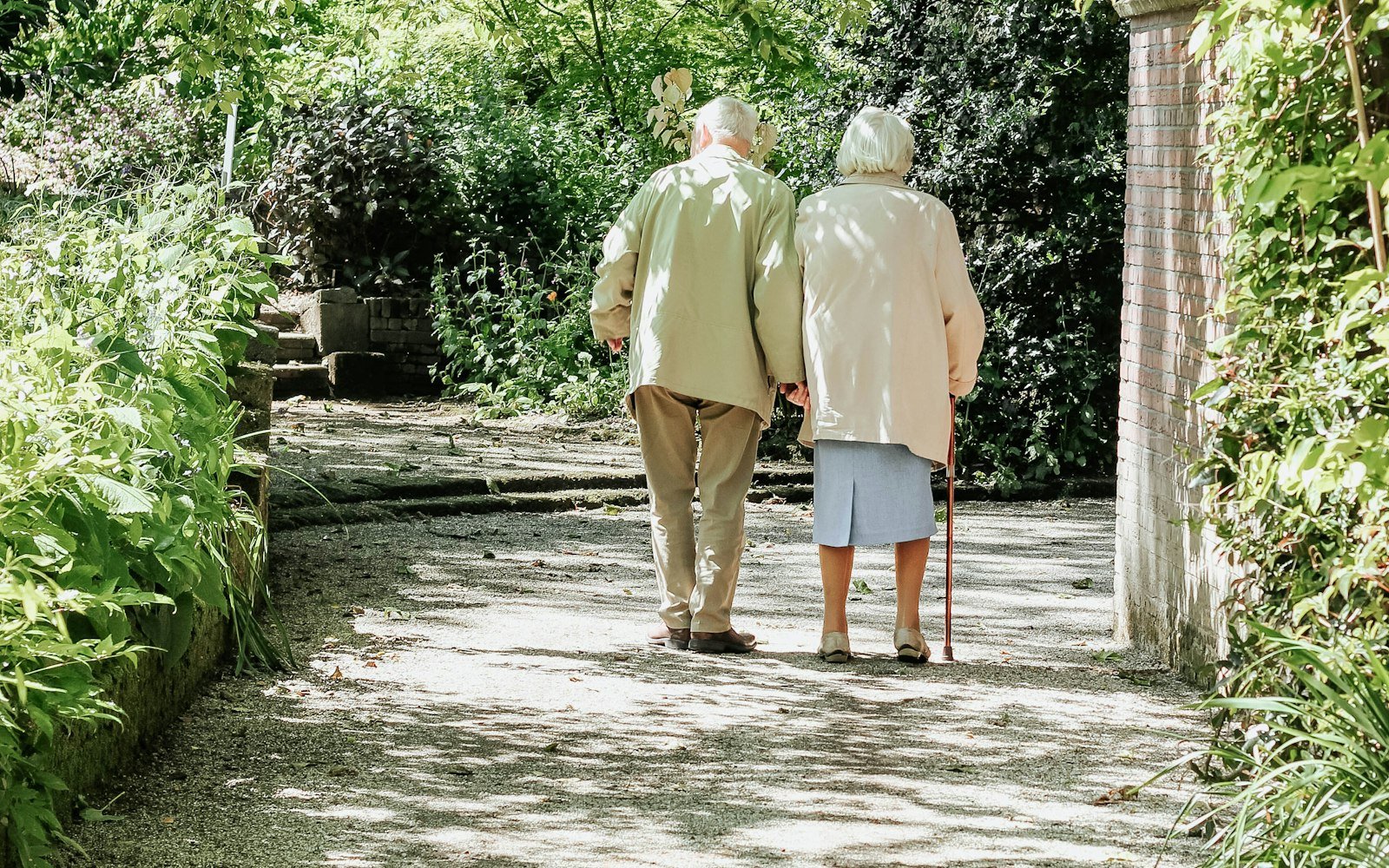 Older couple walking together outdoors